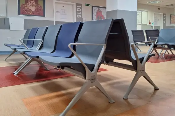 What should hospitals consider beyond price when purchasing hospital beds?